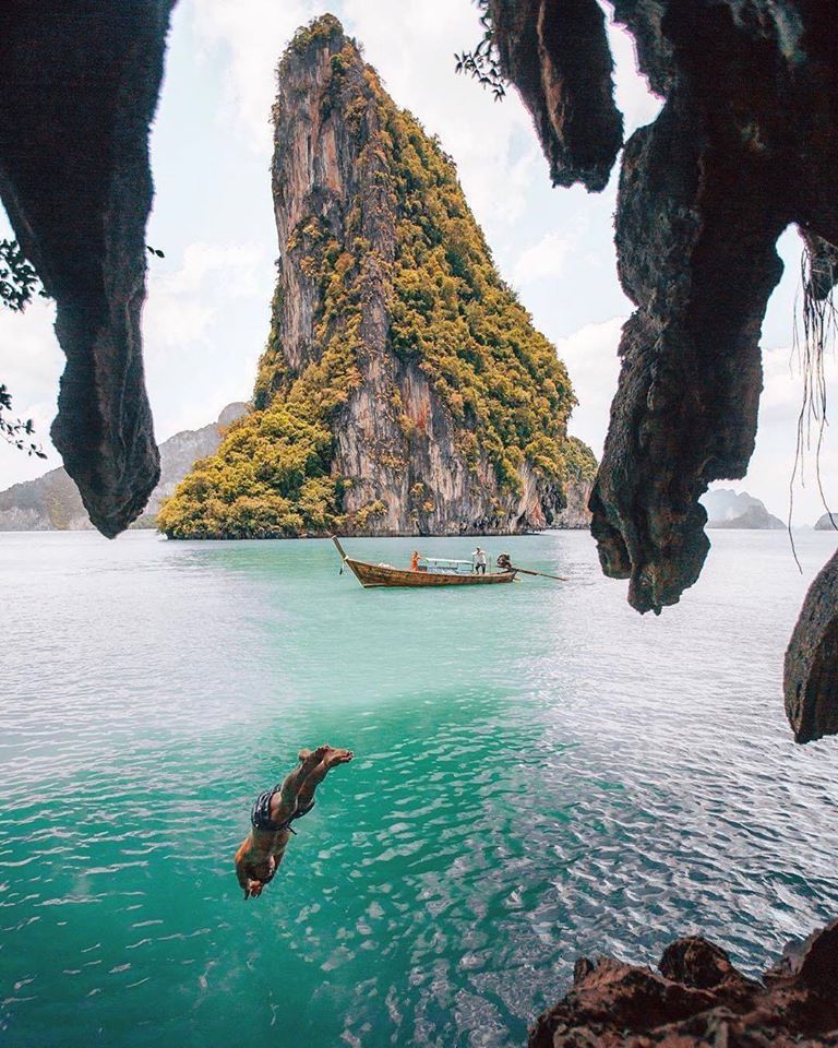 Phuket yacht charter — limestone cliff and longtail